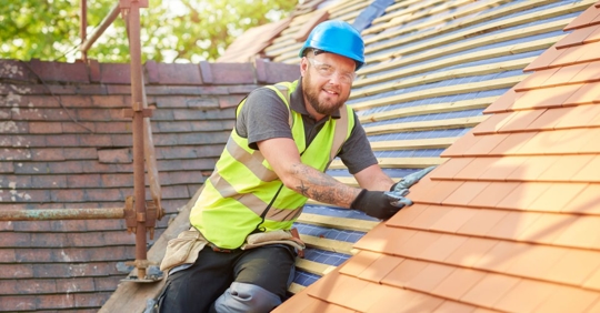roofer installing a new roof
